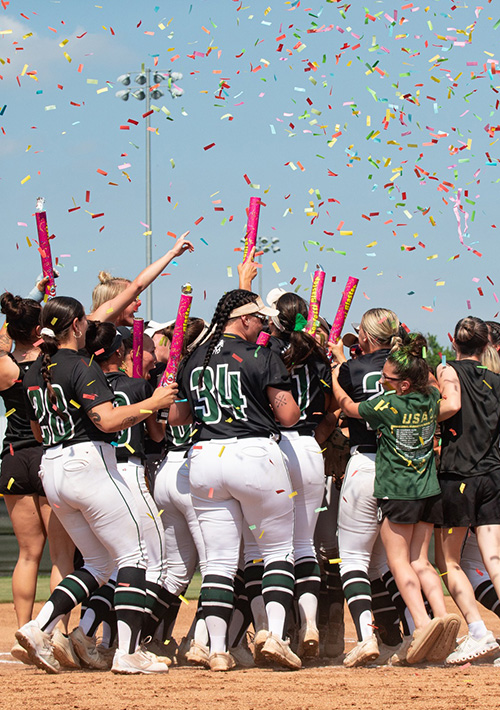 Drover softball celebrates as a team, with confetti