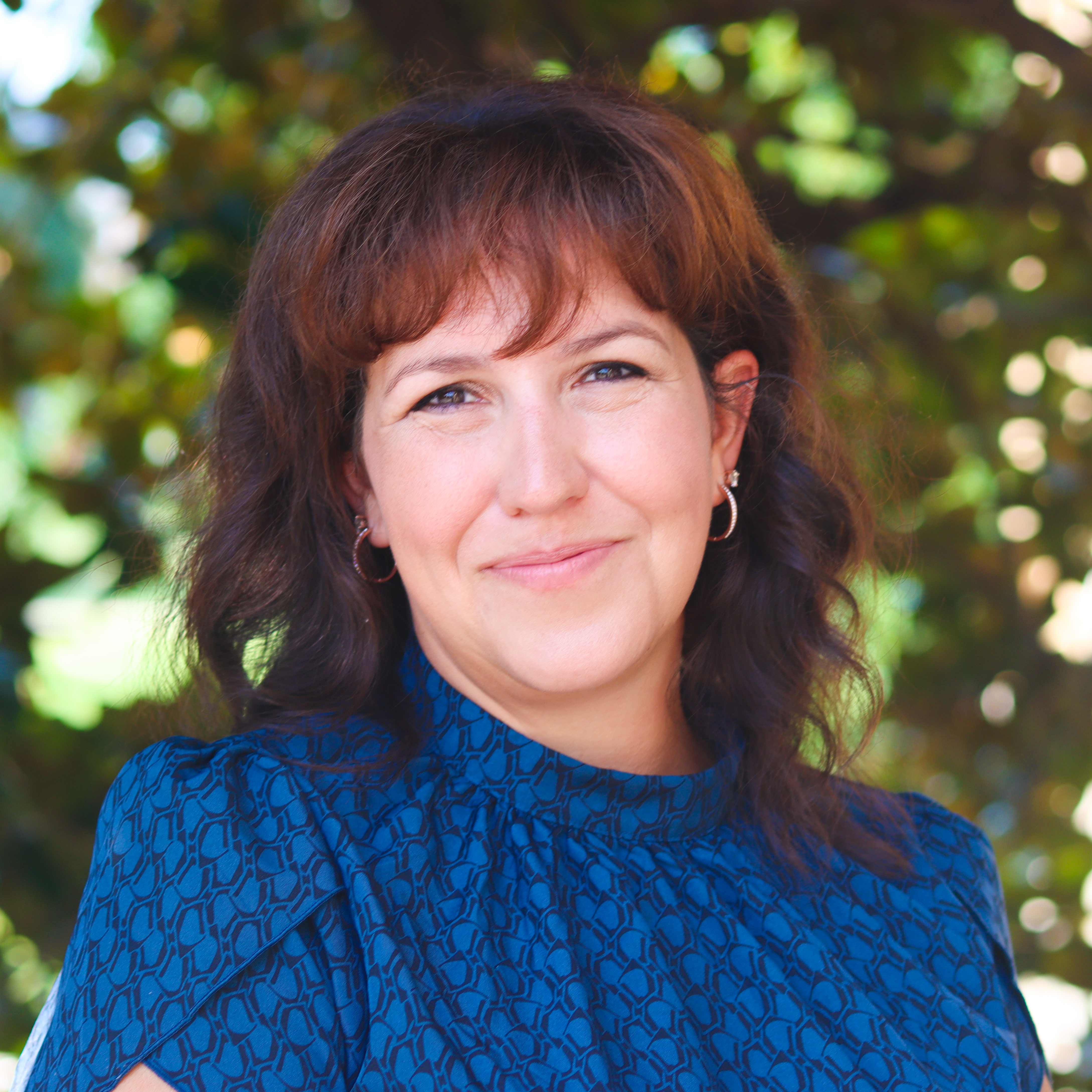 Smiling woman in a blue shirt