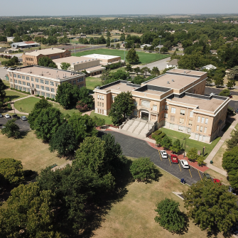 wideshot aerial photo of campus showing some of the buildings and the soccer field