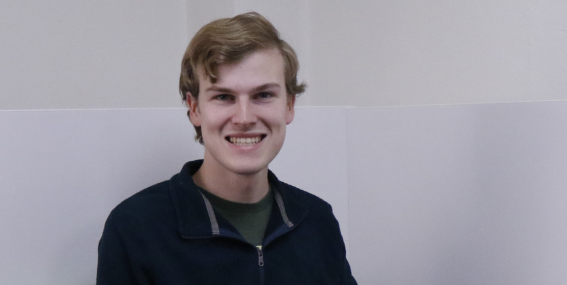 Student smiling to the camera.